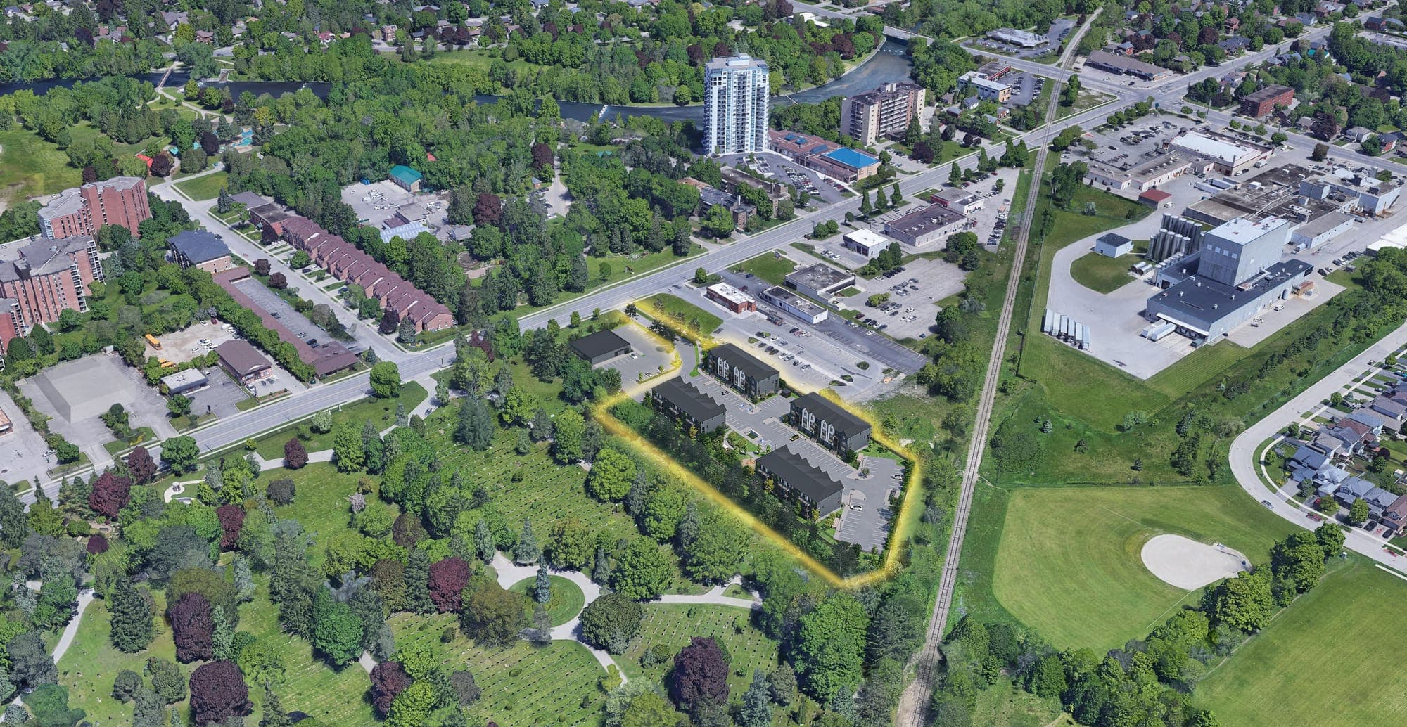 Aerial view of north Guelph with the four Marquis blocks outlined, Woodlawn Memorial Park behind them and Riverside Park and the Speed River across Woolwich Street.